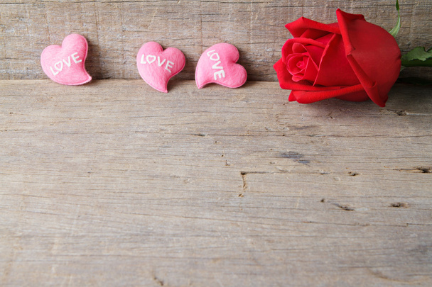 Valentines day background with pink hearts and rose on wooden ba - Фото, зображення
