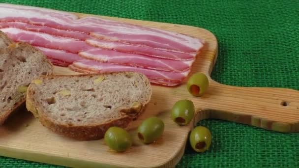 Cutting board with bacon and bread - Footage, Video