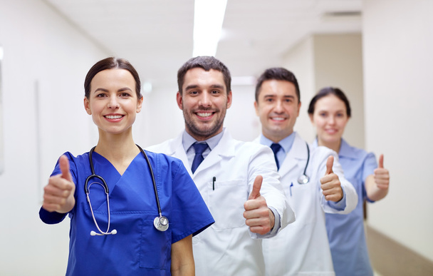 medics or doctors at hospital showing thumbs up - Photo, image