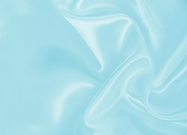 Smooth elegant blue silk or satin as background - 写真・画像