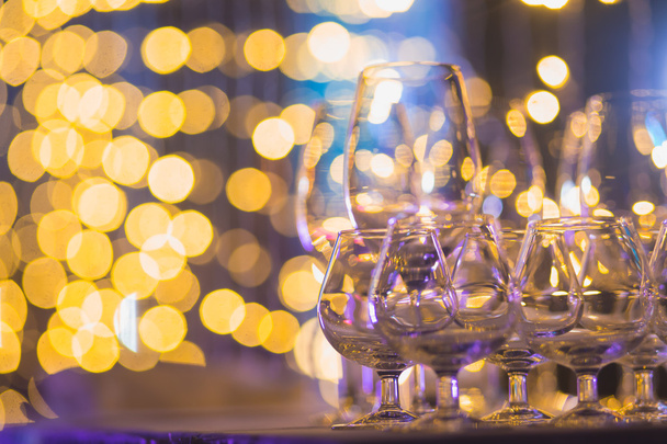 Beautiful row line of different colored alcohol cocktails with mint on a christmas party, martini, vodka,and others on decorated catering bouquet table on open air event, picture with beautiful bokeh - 写真・画像