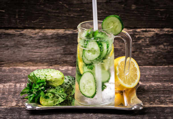 Fresh cold cucumber drink on wooden table - Foto, Imagen