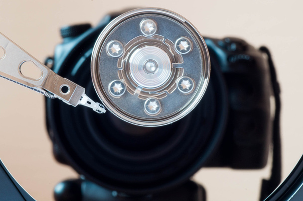 Abstract shot of a shiny hard drive where camera is reflecting - Photo, Image