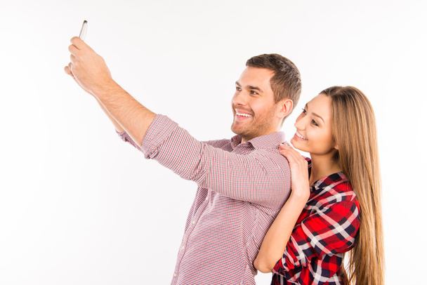 Couple in love making  selfie with hugs  - Photo, image