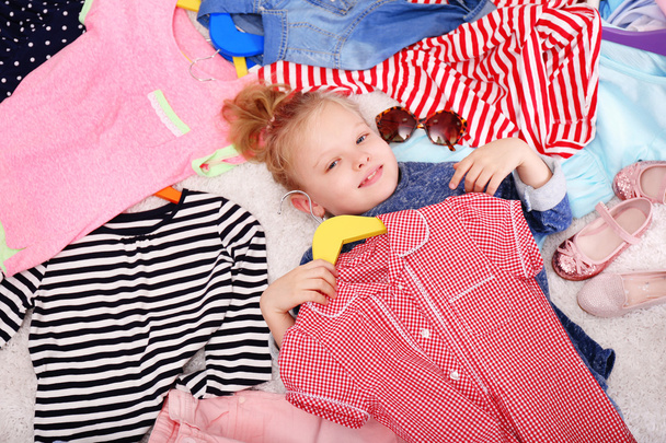Little girl and new clothes - Valokuva, kuva
