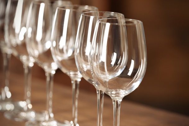 Set of empty wineglasses on wooden table - Valokuva, kuva