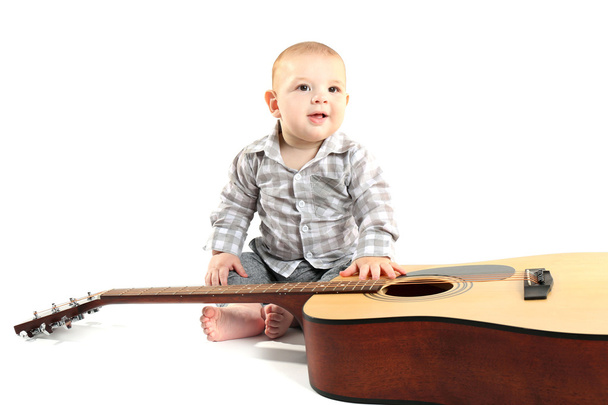 Cute baby with guitar - Foto, Imagen