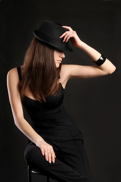 Mafia Girl in a black dress with a hat - Foto, afbeelding