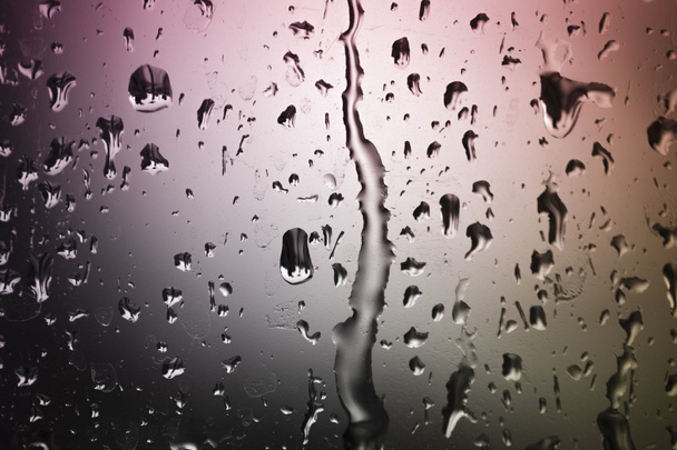 Colorful rain through the window - Photo, Image