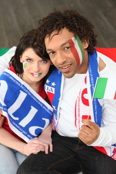Two Italy supporters sat at home - Фото, изображение