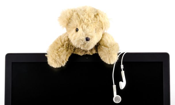 a teddy bears with earphones - Фото, изображение
