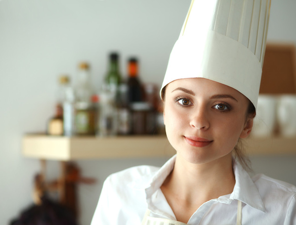 Chef woman portrait with  uniform in the kitchen - Fotó, kép
