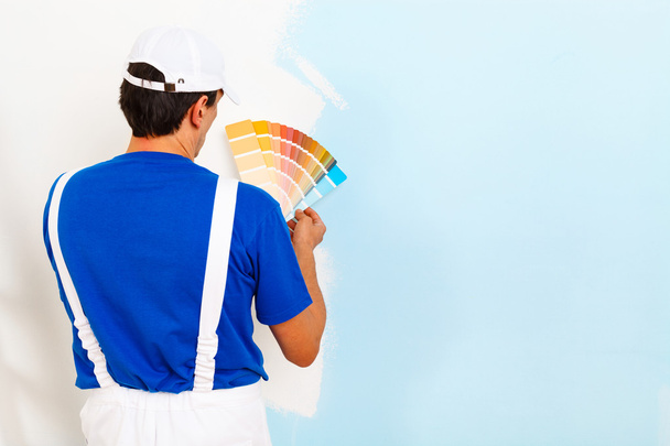 painter man looking a color palette  - Photo, Image