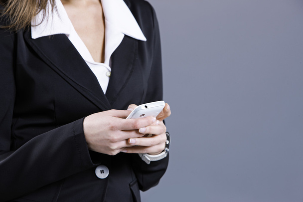 Woman business, text messaging on cell phone - Photo, Image