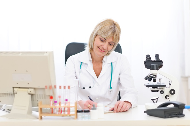 Senior doctor woman working at office - Foto, immagini