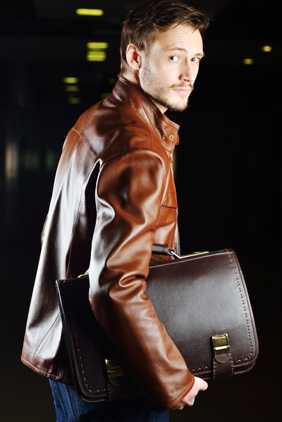 Fashionable young man with leather clothes on - Photo, Image