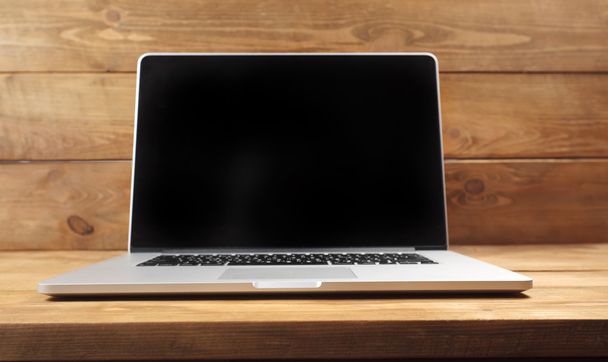 Laptop on wooden table - Φωτογραφία, εικόνα