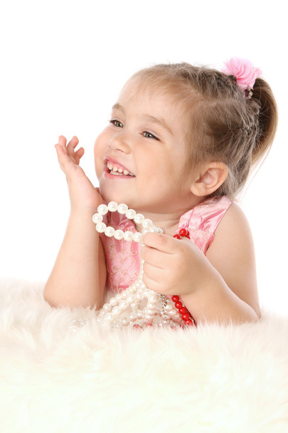 Little baby girl with beads dreaming - Foto, imagen