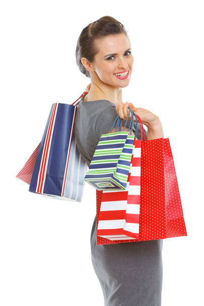 Smiling elegant woman with shopping bags - Фото, зображення