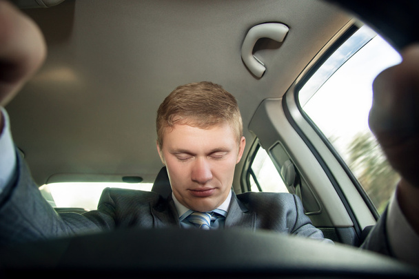 Driver fell asleep at the wheel of a car while driving - Fotó, kép