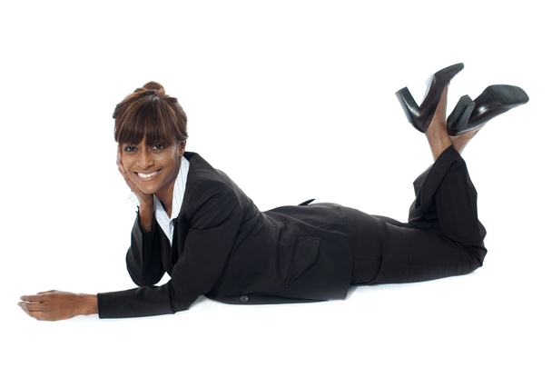 Corporate woman lying on floor, smiling - Fotoğraf, Görsel