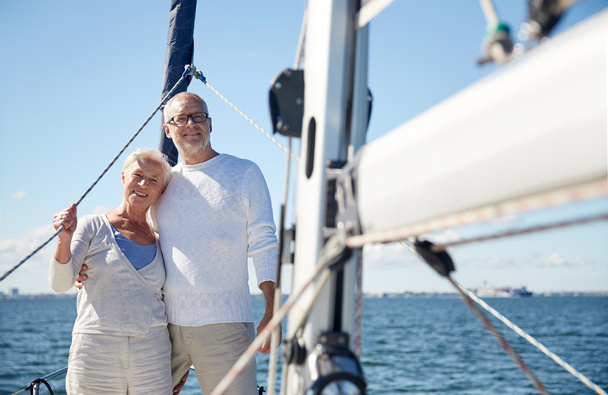 senior couple hugging on sail boat or yacht in sea - Foto, Bild