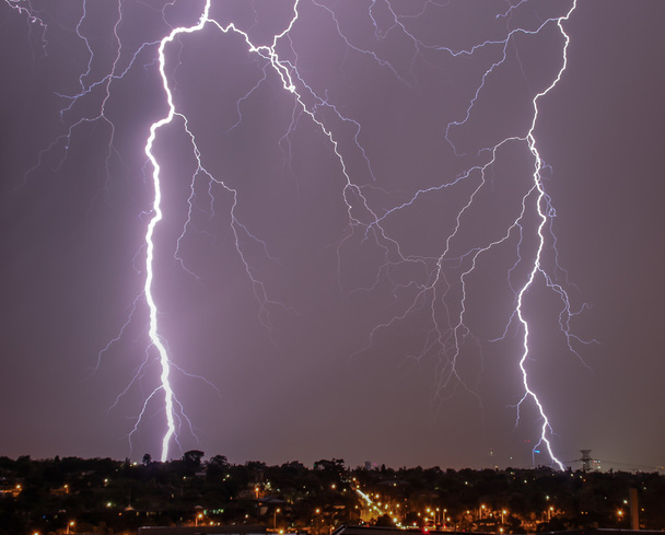Lightning over city skyline - Photo, Image