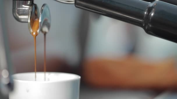 Coffee is poured into a cup - Filmati, video