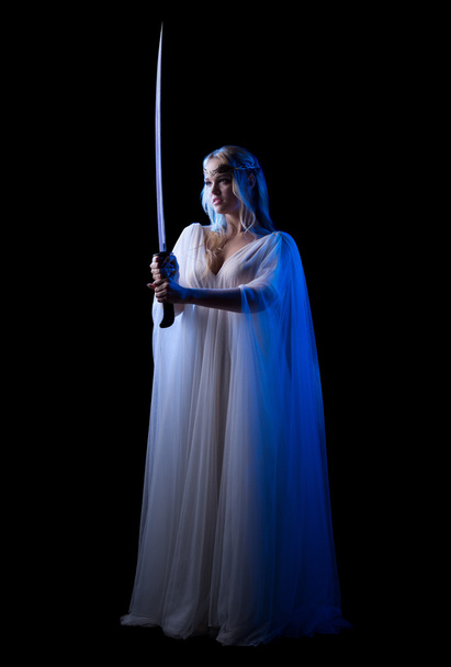 Young elven girl with sword isolated - Fotografie, Obrázek
