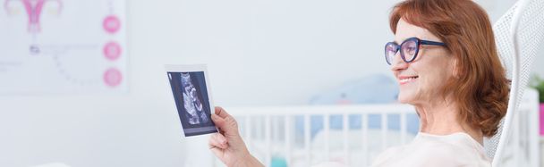 Elderly pregnant with ultrasound photo - 写真・画像