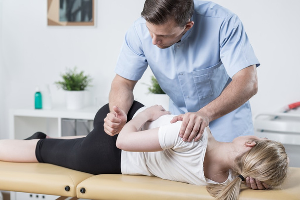 Woman on physiotherapy table - Foto, imagen