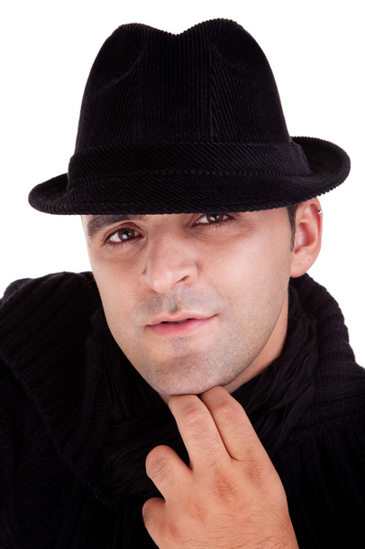 Portrait of a man with his black hat, isolated on white. Studio shot - 写真・画像