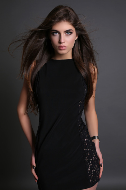 gorgeous sensual woman with dark straight hair wears elegant dress - Foto, Imagen