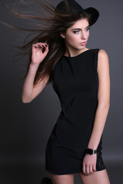 gorgeous sensual woman with dark straight hair wears elegant clothes  - Fotó, kép