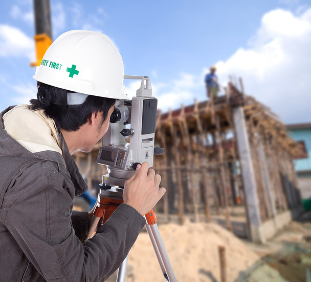 Engineers use tacheometer or theodolite with building constructi - Photo, Image