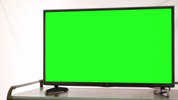 Σύγχρονη τηλεόραση υψηλής ευκρίνειας με πράσινη οθόνη - Πλάνα, βίντεο