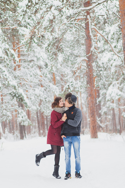 Happy Young Couple in Winter Park having fun.Family Outdoors. love, valentine day - Фото, зображення
