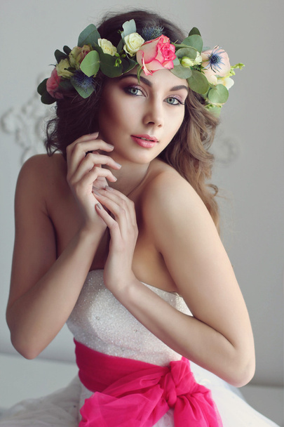 Modern and stylish bride in a floral wreath on her head and with - Φωτογραφία, εικόνα