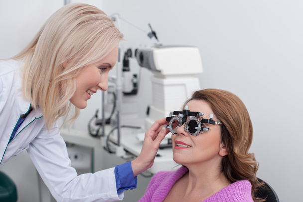 Professional eye doctor is examining human vision - Foto, Bild