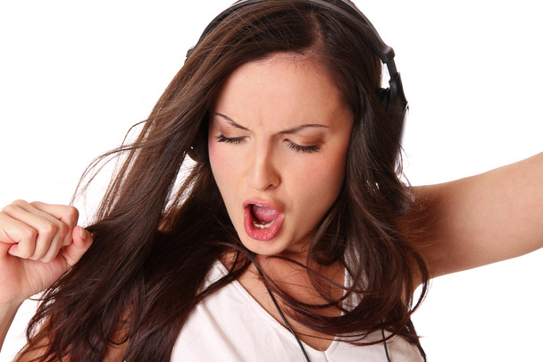 Teenage girl listening music on headphones - Photo, Image