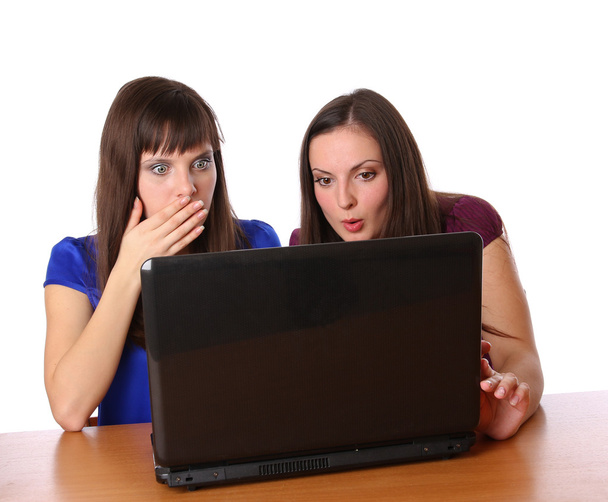 Two girlfriends looking at laptop - Valokuva, kuva