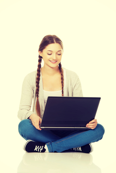 Woman student sitting with laptop. - Foto, imagen
