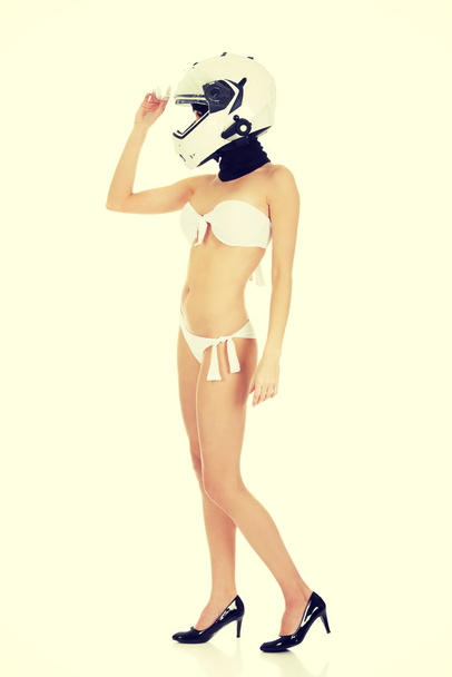 Sexy woman with motorcycle helmet. - Foto, afbeelding