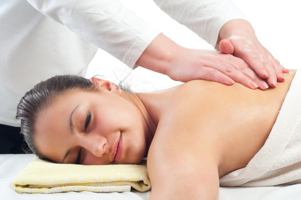 Beautiful young women getting a massage in massage salon - Photo, Image