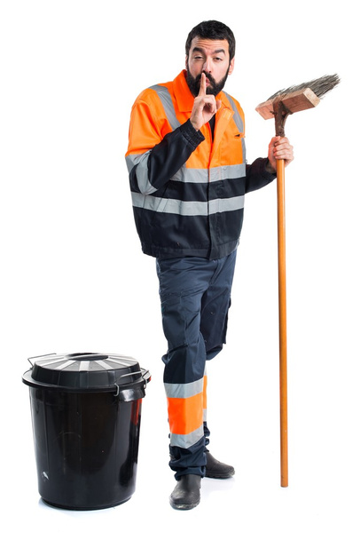 Homem do lixo fazendo gesto de silêncio
 - Foto, Imagem