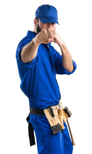 Plumber giving a punch - Photo, Image