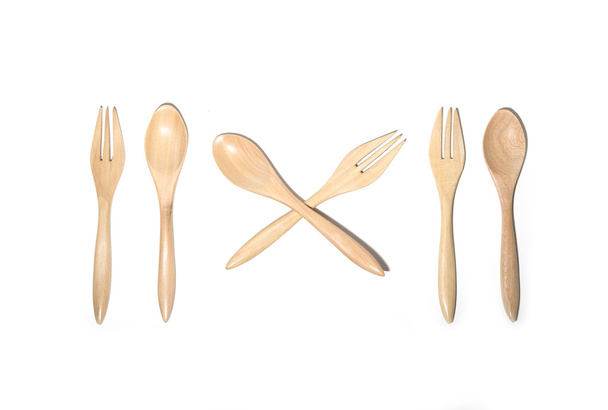 Brown wooden spoons and fork - Фото, изображение