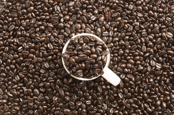 Filiżanka kawy i ziaren kawy - Zdjęcie, obraz