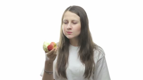 Brunette woman eating apple, fourth video - Video