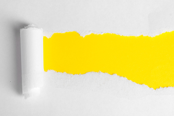 Torn paper with yellow background - Zdjęcie, obraz